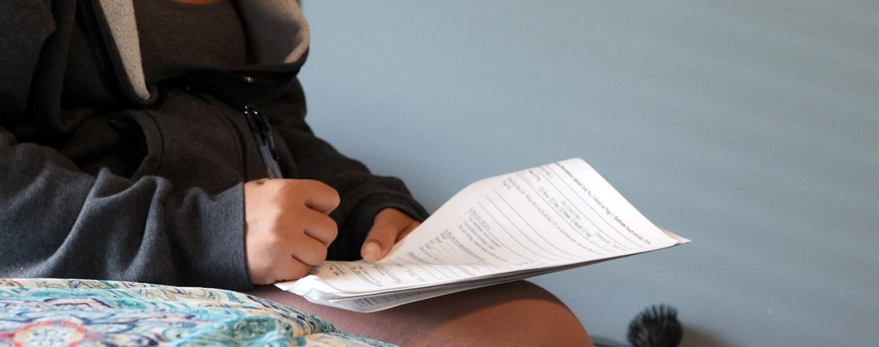 bridgewell woman filing out paperwork