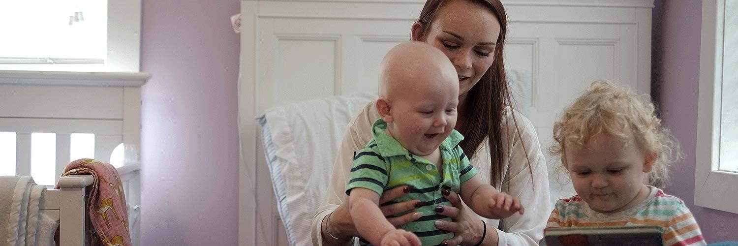 woman in family support center with children