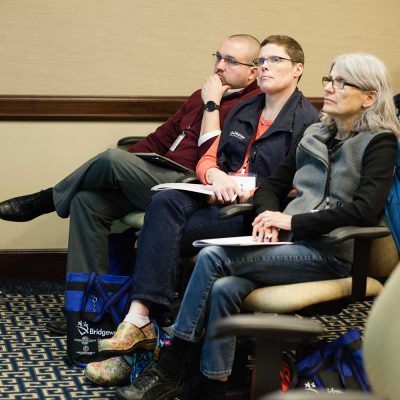 group of people listening to presentation